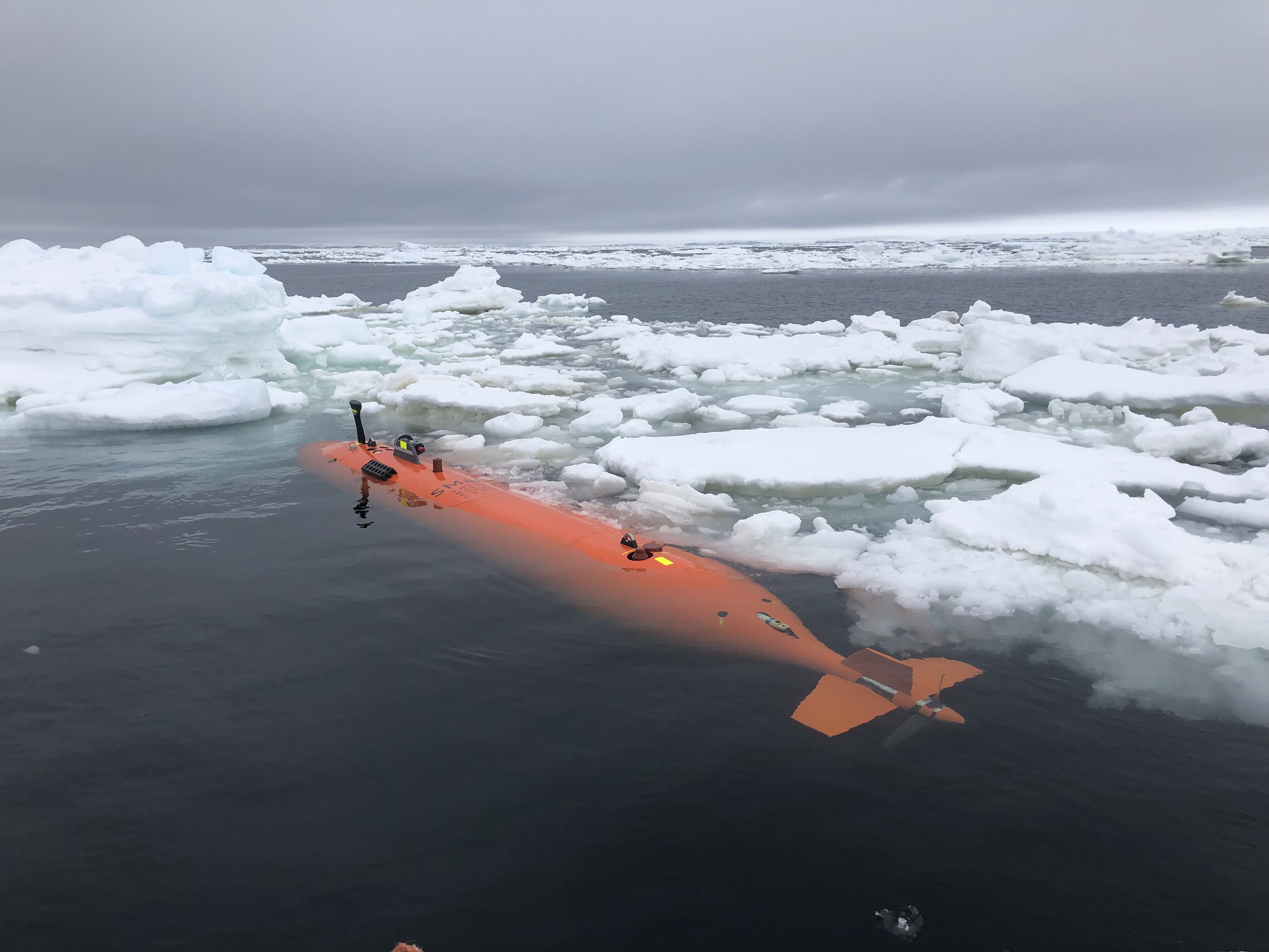Rán, a Kongsberg HUGIN autonomous underwater vehicle, amongst sea ice in front of Thwaites Glacier, after a 20-hour mission mapping the seafloor. (Credit: Anna Wåhlin/University of Gothenburg).