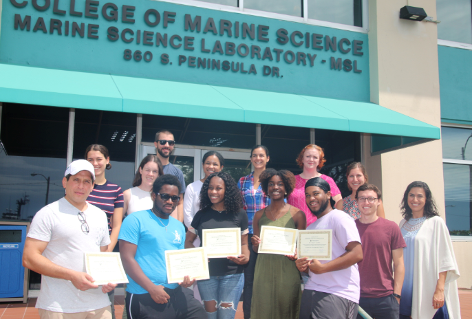 REU participants were awarded their certificates of completion in a commencement ceremony with CMS graduate students and faculty.
