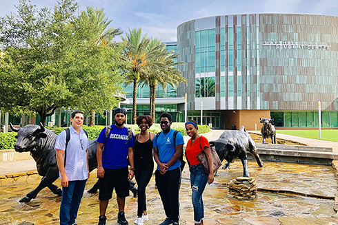 REU participants attended a lunch hosted by Sloan UCEM at USF Top of the Palms with Bernard Batson and COE students. (left to right: Richard Rivera, Angel Cedeño, Jenelle DeVry, Tione Grant, and Alexis Peterson)