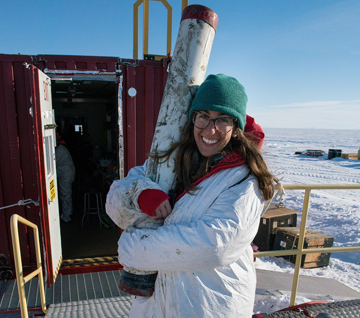 Ryan Venturelli, USFCMS Ph.D. student, holds the first ever gravity core from a subglacial lake. Photo Credit: Billy Collins, SALSA