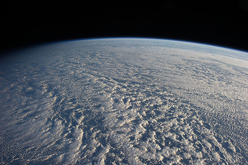 A new theory proposed by two scientists, called the Quasi-Normal Scale Elimination (QNSE) theory, holds great promise to revolutionize the physics behind turbulent flows in the atmosphere and ocean. This image was taken by crew members aboard the International Space Station when they flew above the northwestern Pacific Ocean. Credit: NASA 