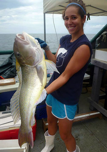 The lead author, Susan Snyder, holds a tilefish caught for the study in the northern Gulf of Mexico.