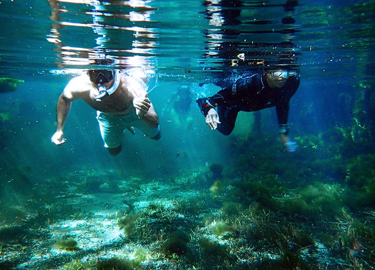 Keith Keel & Karyna Rosario swimming.