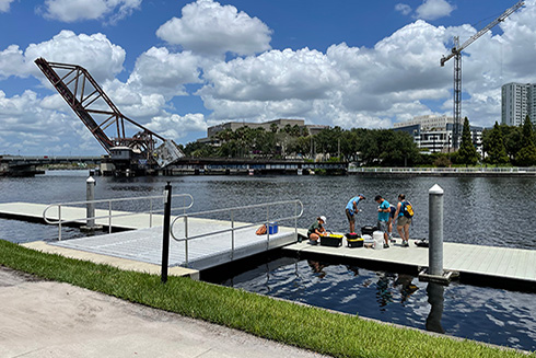 Graduate students Hannah Hunt (USF), Dylan Halbeisen (USF), Ilana Farrell (OSU) work with Dr. Salvo Caprara (USF) and Dr. Joe Tamborski (ODU) to sample the Hillsborough River. The team is collecting dissolved metals and organic matter and measuring the salinity, temperature and pH of the river. Credit: Tim Conway, USF