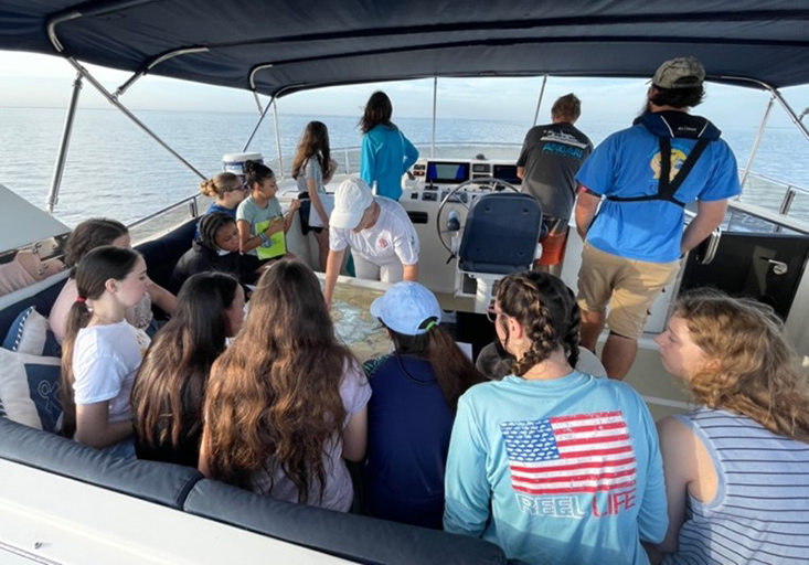 Teresa Greely orients the campers to where the day’s activities will take place in Tampa Bay as the R/V Angari gets underway.