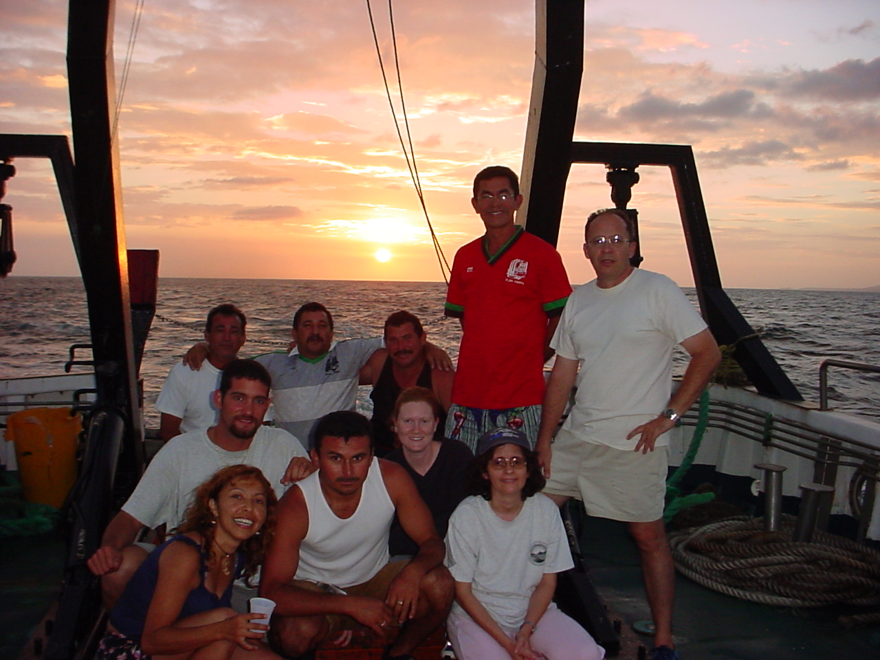 The sun sets on the 21-year CARIACO Ocean Time Series program, which was led by scientists from the U.S. and Venezuela and involved more than 100 researchers from the around the globe. Shown in the photo: Ramón Varela (Co-PI, EDIMAR/FLASA), Yrene Astor (Co-PI, EDIMAR/FLASA), José (Chuchú) Narváez (EDIMAR/FLASA), Aitzol Arellano (EDIMAR/FLASA), Michael McIntyre (USF/U.S.), Glenda Arias (EDIMAR/FLASA), Aparicio Narváez (First Officer), Maxi (crew), German Marin (Chef), and Julio (crew).