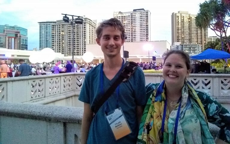 IMaRS lab members attending the opening reception on the Hawaiian Convention Center rooftop garden terrace (other IMaRS attendees lost in the sea of networking), Tylar Murray and Savannah Hartman