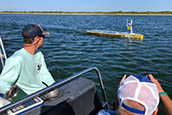 USF Oceanographers follow an uncrewed autonomous boat. The vehicle is helping create hyper-detailed maps of the seafloor just off the coast. (Courtesy of David Levin)
