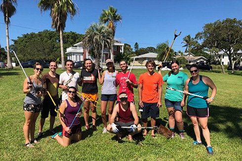 College of Marine Science students pose with trash pickers after a long day’s work 