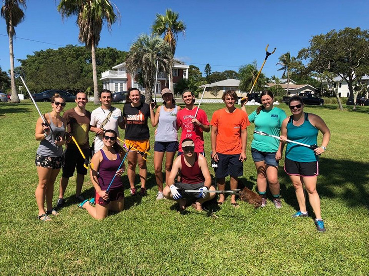 College of Marine Science students pose with trash pickers after a long day’s work 