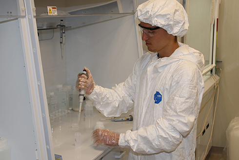 CMS graduate student Brent Summers process samples in the lab at the USF College of Marine Science (USF CMS). CMS donated more than 25 boxes of lab gear to Bayfront Health St. Petersburg, a medical facility down the street from campus. 