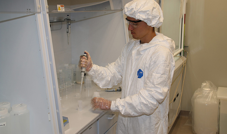 CMS graduate student Brent Summers process samples in the lab at the USF College of Marine Science (USF CMS). CMS donated more than 25 boxes of lab gear to Bayfront Health St. Petersburg, a medical facility down the street from campus. 