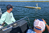 USF Oceanographers follow an uncrewed autonomous vessel. The vehicle is helping create hyper-detailed maps of the seafloor just off the coast. (Image: David Levin)
