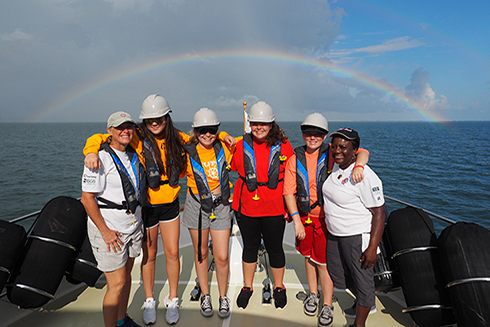 Oceanography Camp for Girls (OCG) is a three-week summer program for young women from Pinellas County. Dr. Teresa Greely (far left), has served as the Camp’s director since 1994. Dr. Angela Lodge (far right), a former social worker and youth development expert co-directed OCG with Greely for more than 20 years.