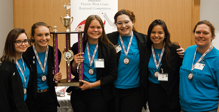 The first place team, Academy of Environmental Science holds the coveted Spoonbill trophy after a stunning victory. 