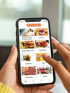 Person scrolling on the GrubHub app on their phone