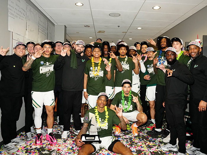 USF Men's Basketball team and coaches celebrating