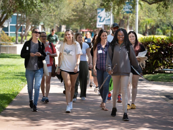 Group of people taking a tour of campus