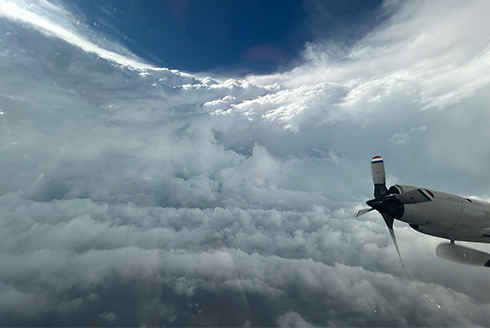 airplane above the clouds over Hurricane Beryl
