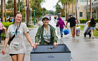 Students and parents walk on campus during move-in day
