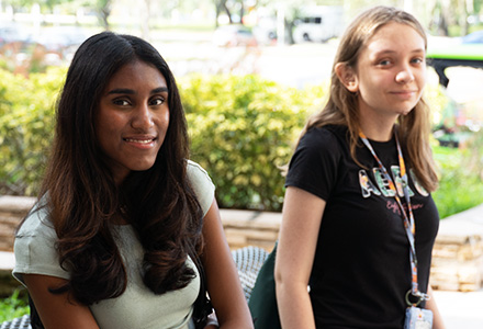 Niayathi and Reagan smile at the camera