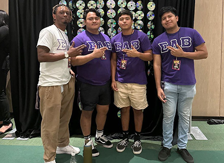 Thomas poses with some fraternity brothers