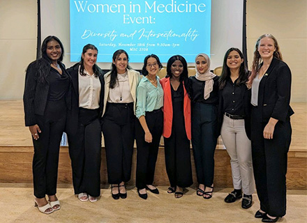 drago poses with group at a women in medicine convention