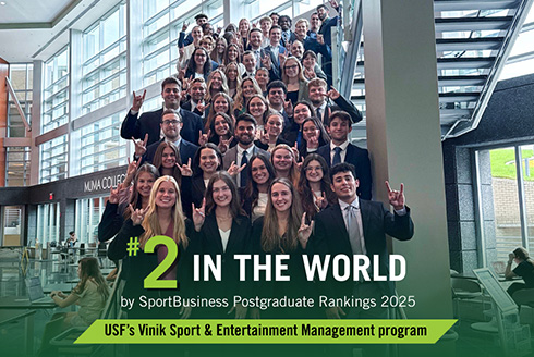 Group of students give the Go Bulls hand signal with graphic that says #2 in the world