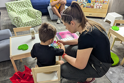 Teacher and student in a classroom