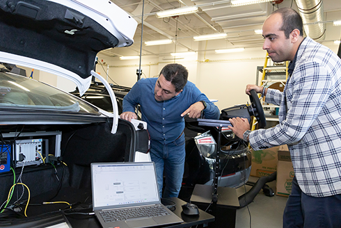 USF engineers inspect self-driving vehicle