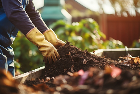 Person composts for garden