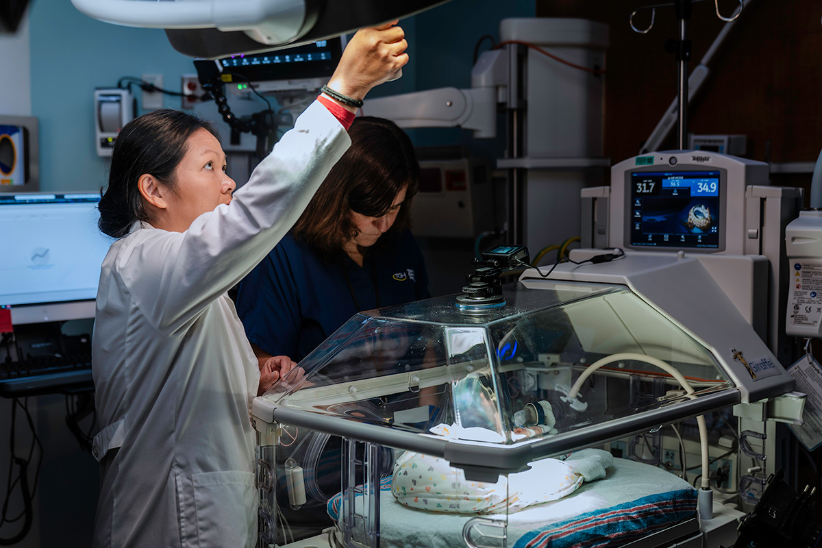 Doctor adjusting light