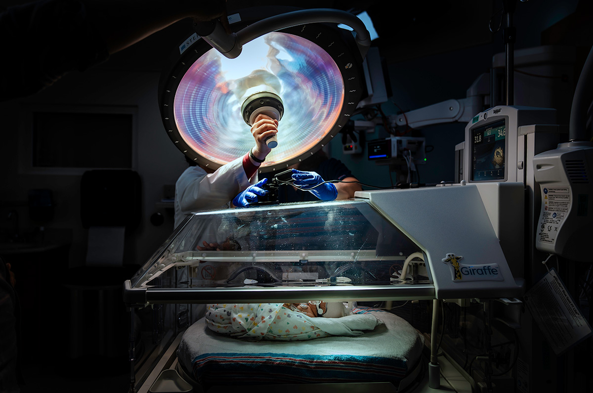 Doctor adjusting light