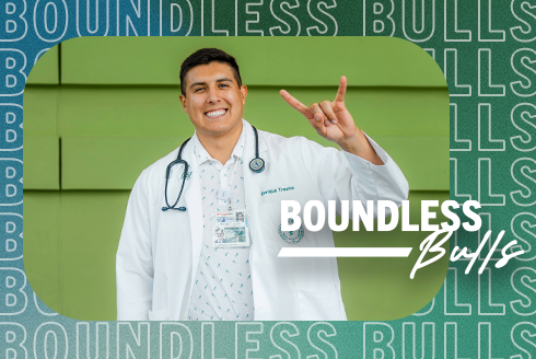 Enrique Trevino wearing a USF Health Morsani College of Medicine white coat, showing the 'go bulls' hand signal. Text says, Boundless Bulls.