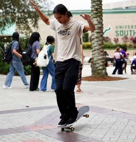 woman skateboards at usf