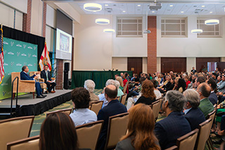 Moez Limayem speaks during a forum