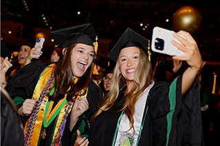 Two students at USF commencement