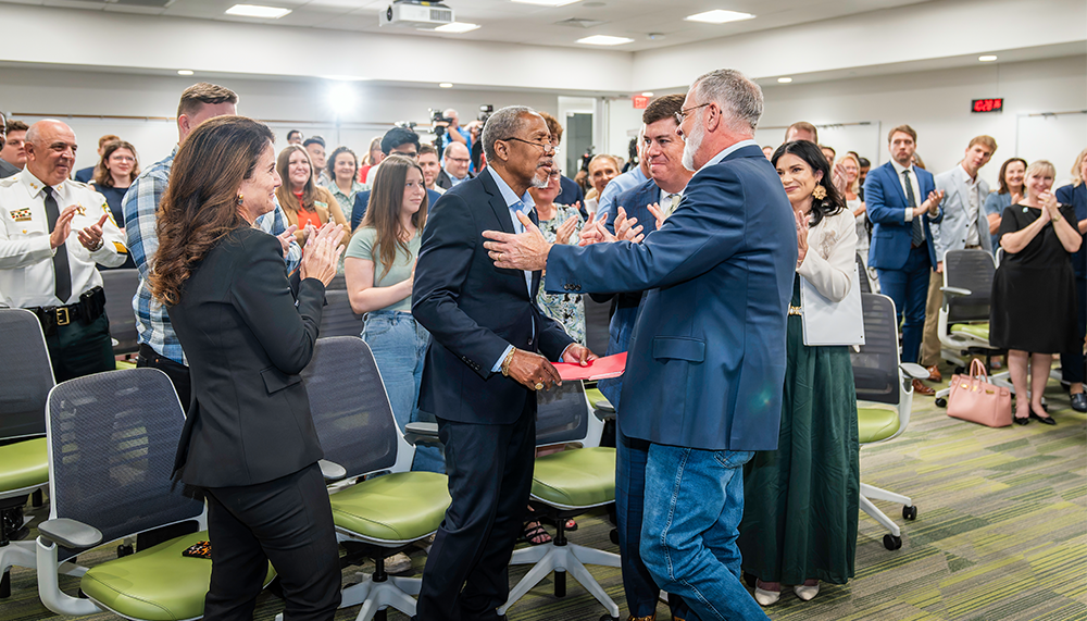 Sen. Darryl Rouson gets applauded during media event