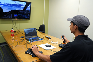 usf student uses a plane simulation