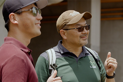 Daniel Yeh stands with a colleague in Hawaii