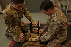 Two servicemembers check out the JCREW