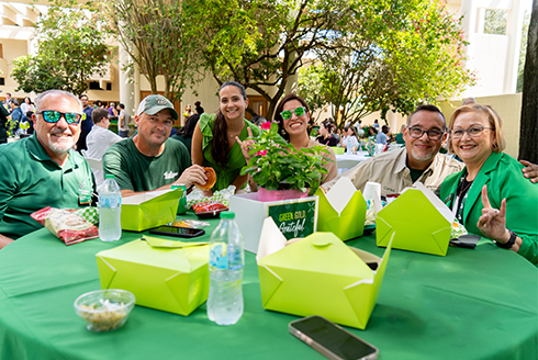 Staff members sit at a table during staff appreciation luncheon