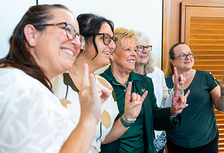 President Rhea Law with members of the College of Behavioral and Community Sciences