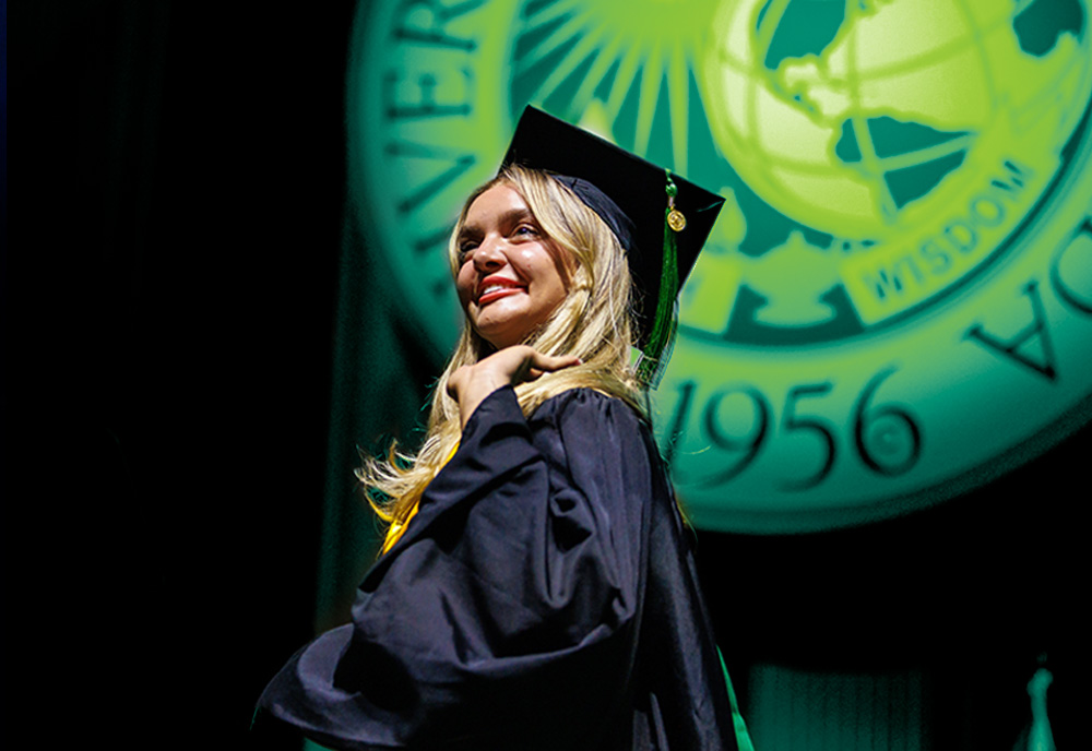 USF student crosses stage at USF commencement