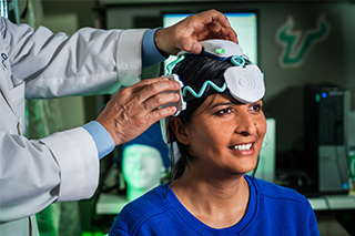 Woman wears a device to detect Alzheimer's disease