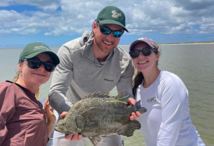 Lucas Griffin and team with a tripletail fish