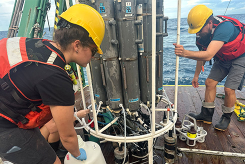Two researchers on a vessel