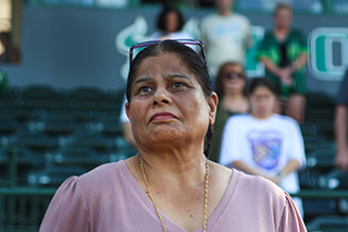 Woman stands during moment of silence
