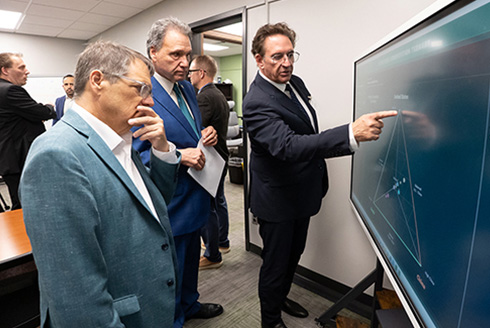 Rep. Gus Bilirakis, USF President Moez Limayem and Professor Mark Abdollahian explore the new Security Analysis and Innovation Lab (SAIL).