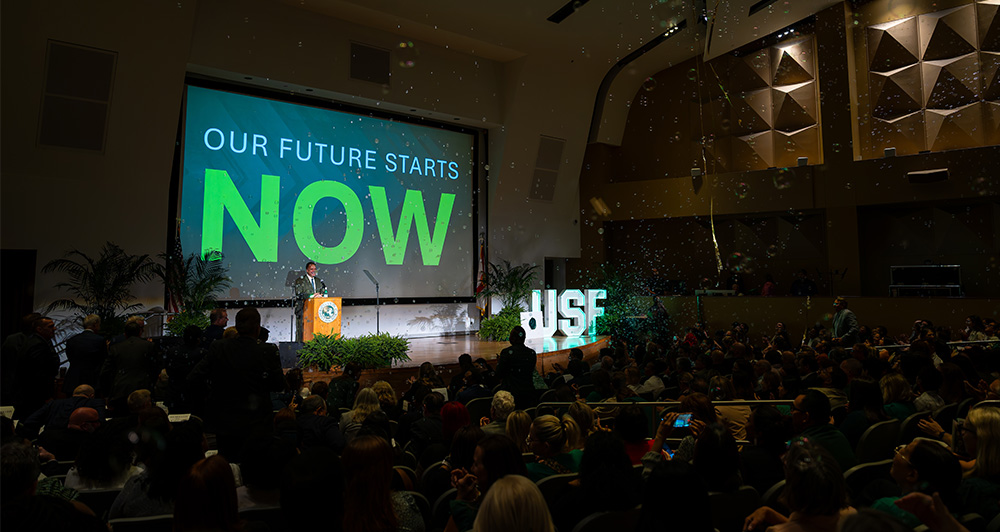 President Moez Limayem on stage during the fall address